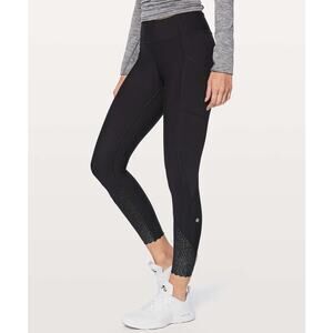 Lululemon Tight Stuff leggings featuring scalloped hem with reflective detail 6